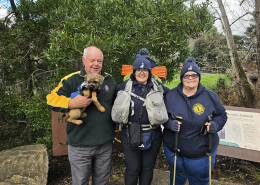 Sheryl with two other Lap the Map supporters and an assistance dog